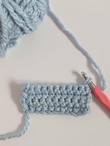Rectangle piece of crochet, all worked in single crochet stitches in a light blue colour