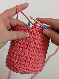 Crochet Pink Pencil Pot, final round of slip stitches work at top of crochet pot