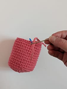 Yarn tail threaded onto tapestry needle