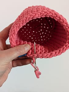 Other side of threading yarn through the stitch