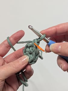 The beginning of the second round of single crochet stitches