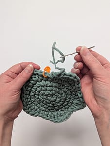 Yarn tail cut and threaded onto a yarn needle