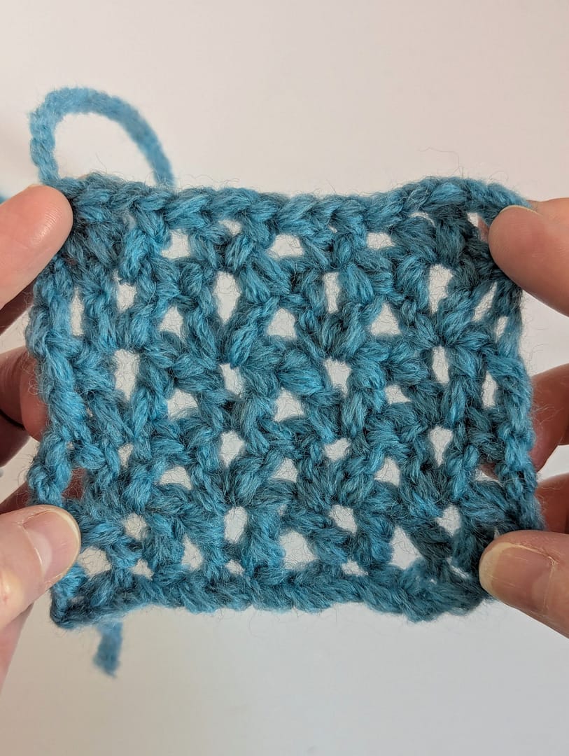 V stitch crochet pattern in blue yarn